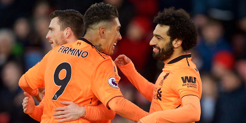 Firmino merayakan golnya dengan rekan setim