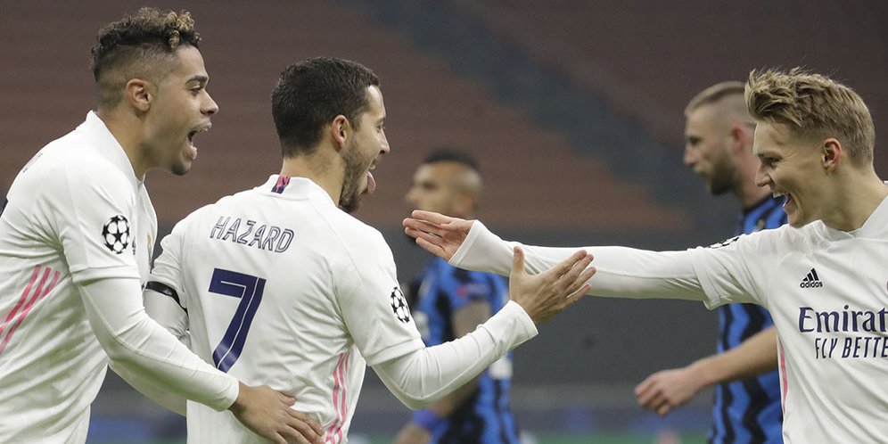 Pemain Real Madrid, Eden Hazard, merayakan golnya ke gawang Inter Milan dalam laga lanjutan fase grup Liga Champions hari Kamis (26/11/2020). (c) AP Photo